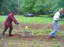 Granddaddy and Uncle Ed with the Seed Planter